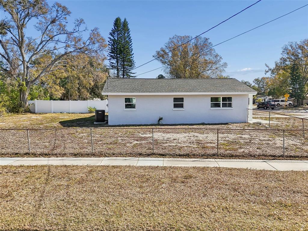 7097 Delta Way Clearwater, FL 33764 - Photo 60 of 71 front view of a house with a yard