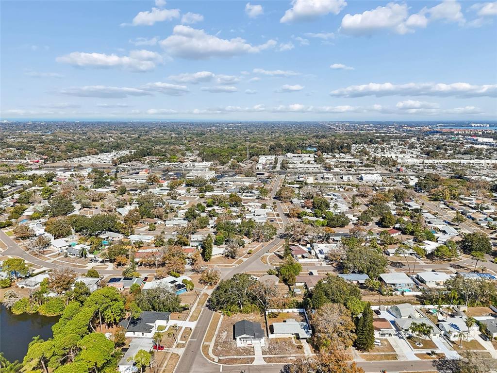 7097 Delta Way Clearwater, FL 33764 - Photo 68 of 71 an aerial view of residential building with green space