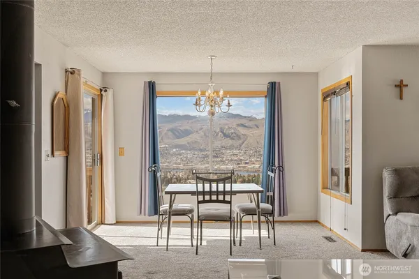 a dining room with furniture and window