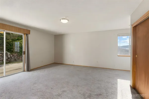an empty room with sliding door