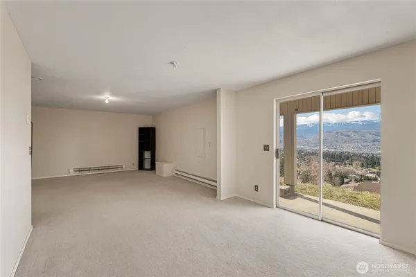 a view of an empty room with a window