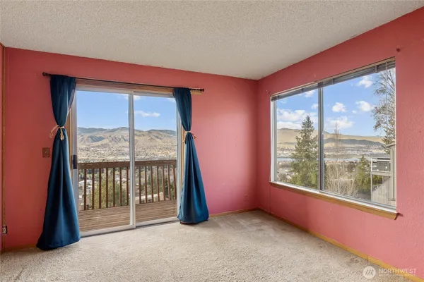 an empty room with a large window