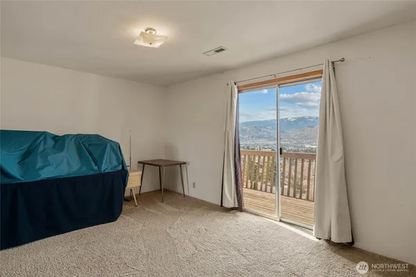 a view of workspace with furniture and window