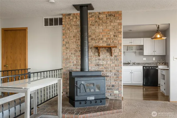 a kitchen with a refrigerator and a stove