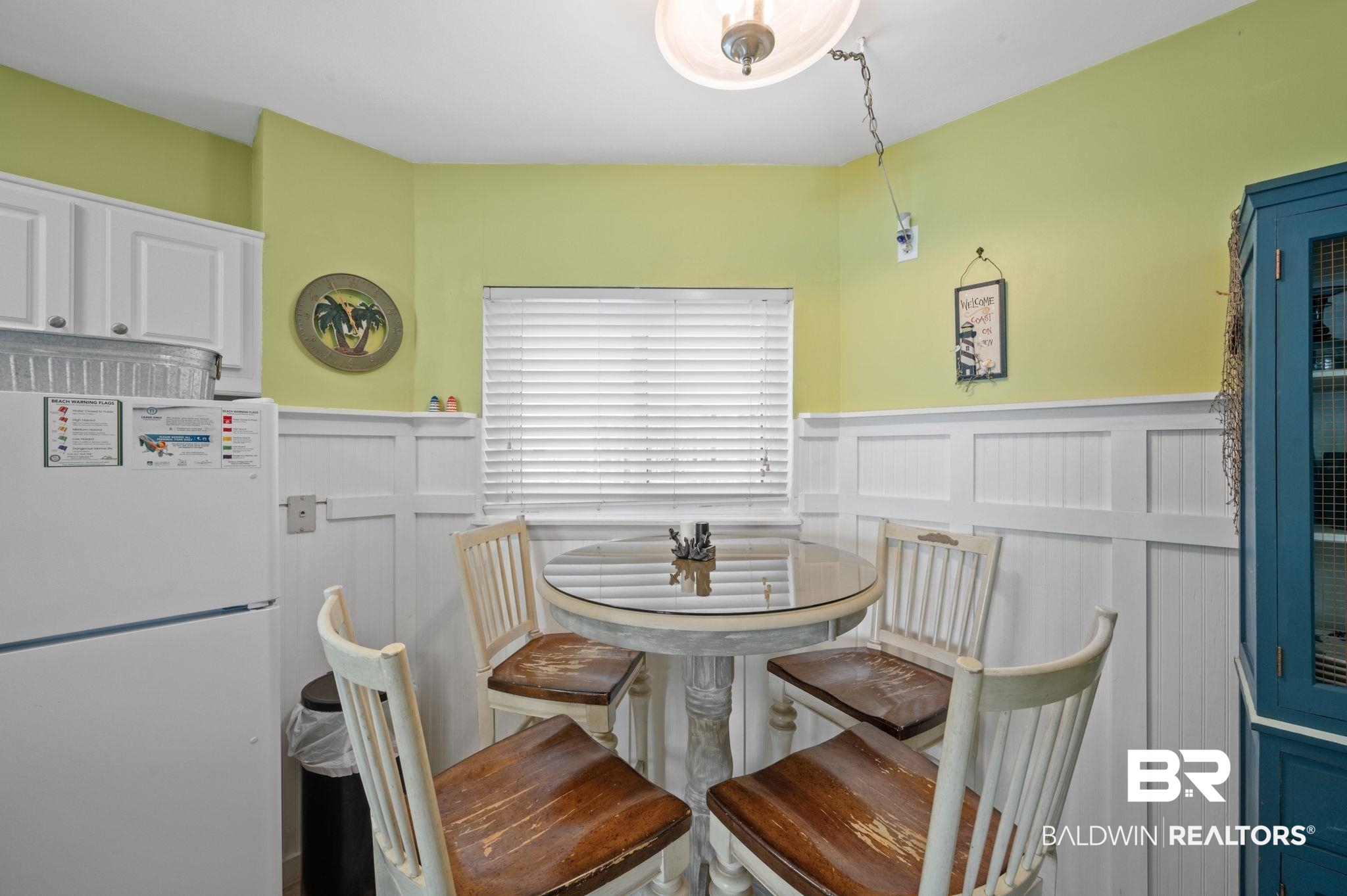 375 Plantation Road, Unit 5304 Gulf Shores, AL 36542 - Photo 13 of 42 Dining area with wainscoting and a decorative wall