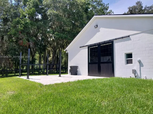 a view of a park with large trees