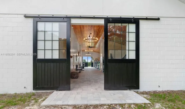 a view of staircase and kitchen view