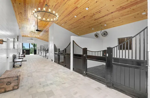 a lobby with furniture and a chandelier