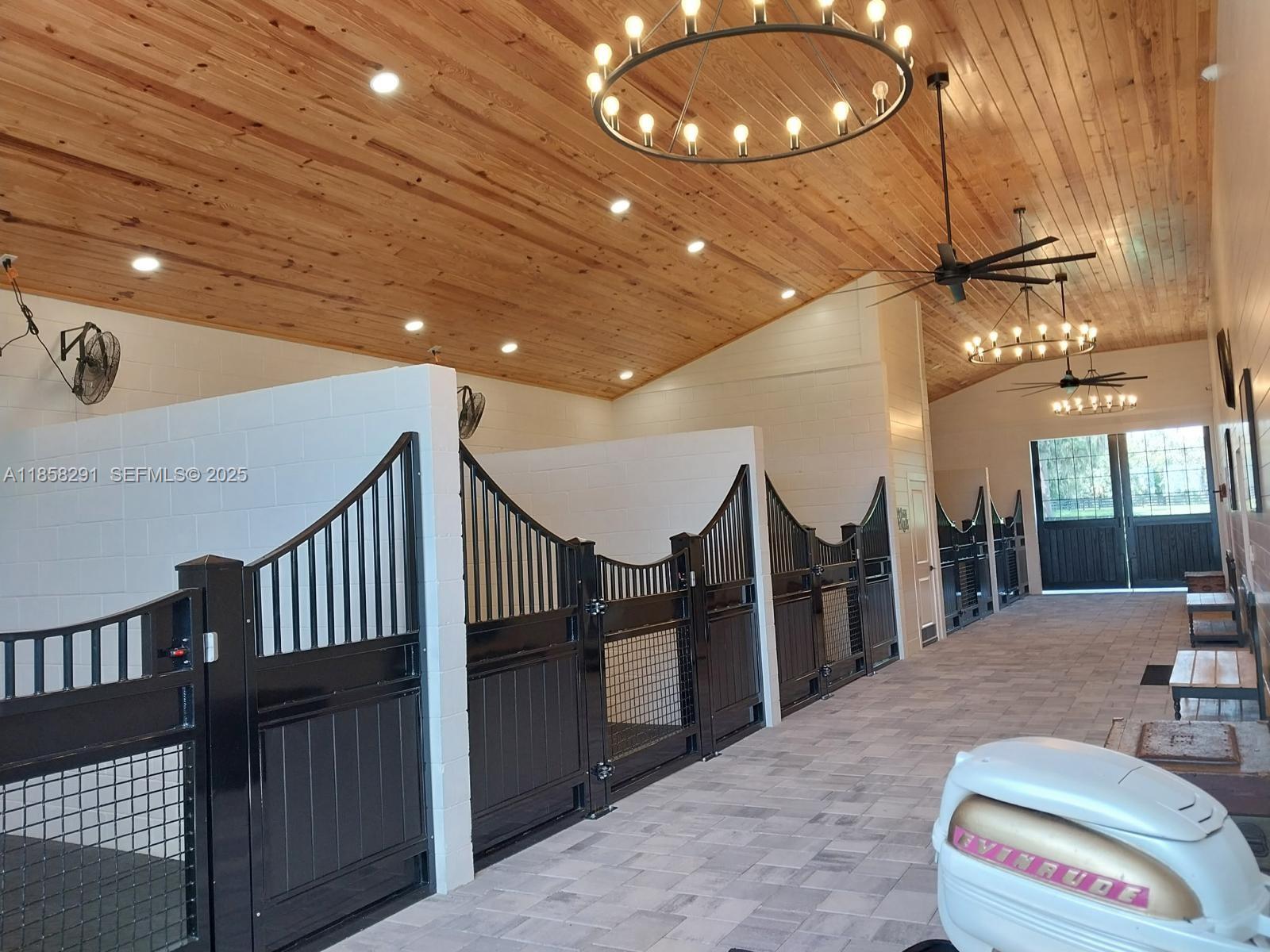 20925 Northwest 100th Avenue Road Micanopy, FL 32667 - Photo 5 of 19 a lobby with furniture and a chandelier