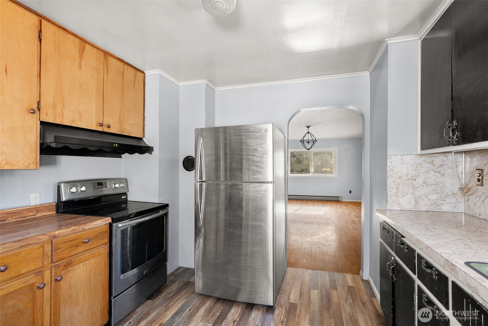 1335 Centralia Alpha Road Chehalis, WA 98532 - Photo 12 of 32 a kitchen with stainless steel appliances granite countertop a refrigerator a stove and a microwave