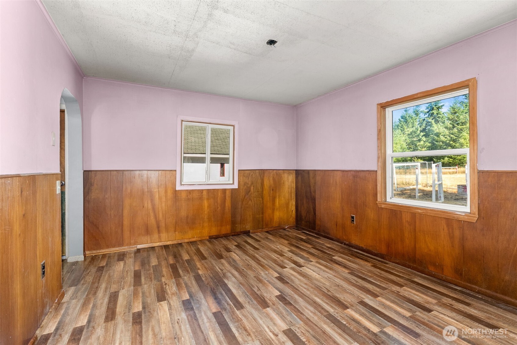 1335 Centralia Alpha Road Chehalis, WA 98532 - Photo 13 of 32 a view of an empty room with wooden floor and a window