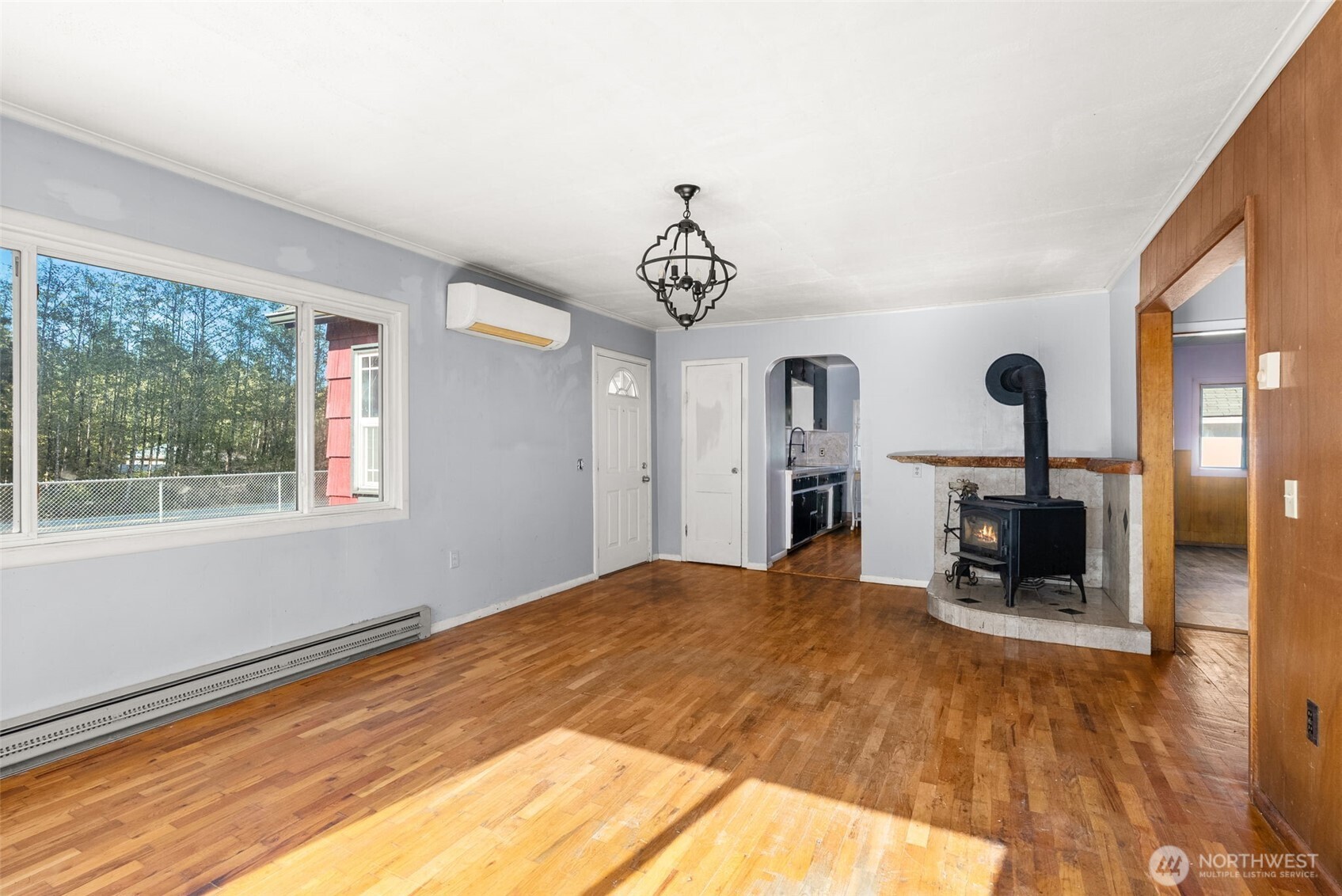 1335 Centralia Alpha Road Chehalis, WA 98532 - Photo 9 of 32 a bedroom with a bed and a chandelier