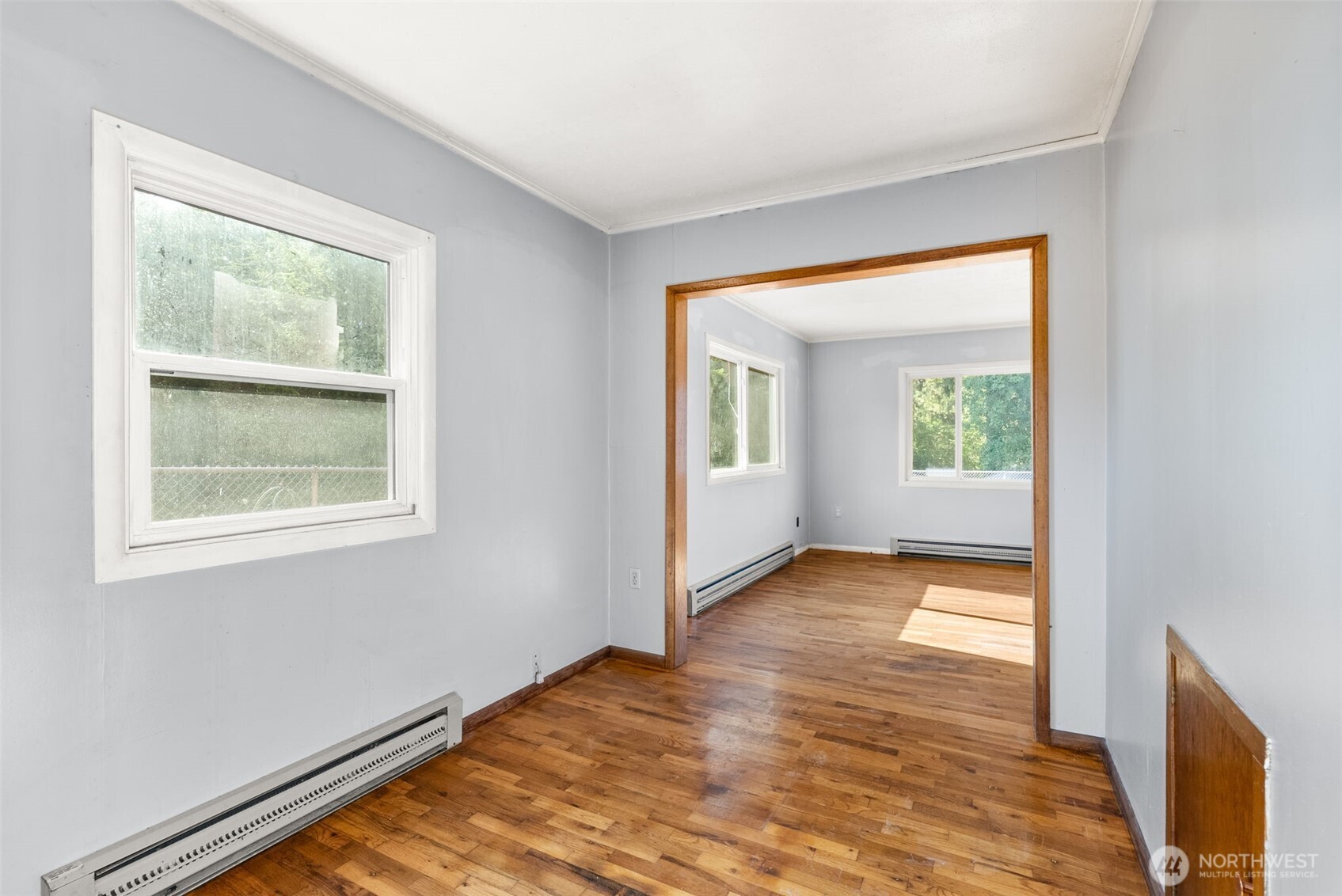 1335 Centralia Alpha Road Chehalis, WA 98532 - Photo 10 of 32 an empty room with wooden floor and windows