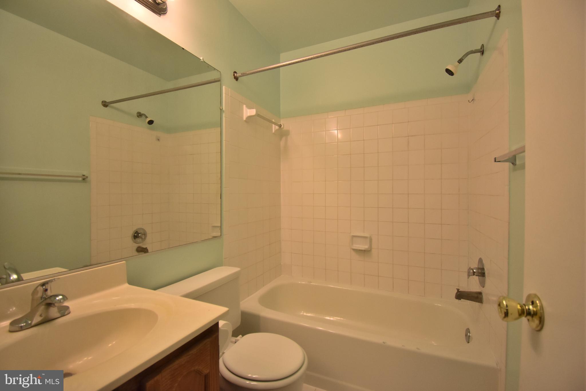 13233 Copeland Court Silver Spring, MD 20904 - Photo 14 of 20 a bathroom with a sink toilet and shower