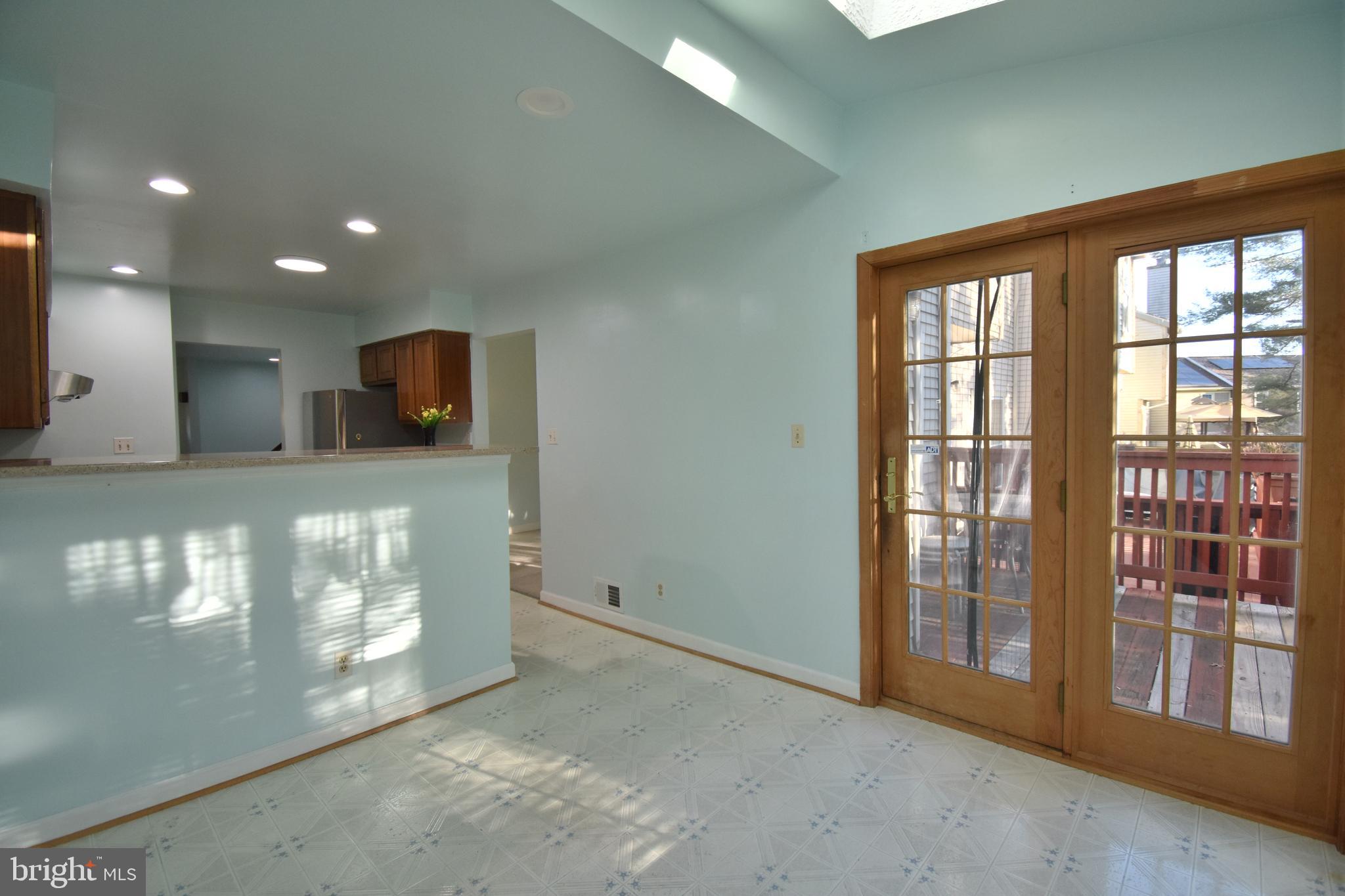 13233 Copeland Court Silver Spring, MD 20904 - Photo 9 of 20 a view of an empty room with a fireplace and a window