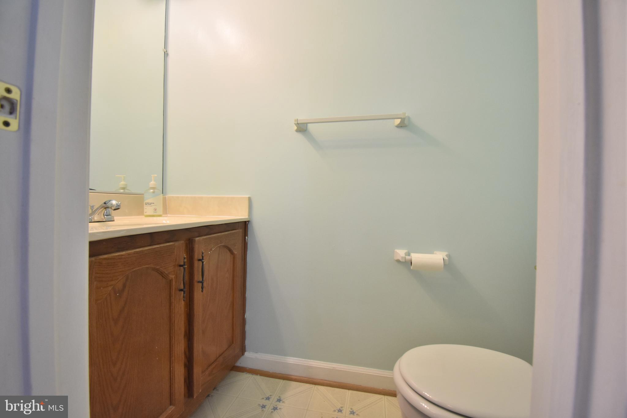13233 Copeland Court Silver Spring, MD 20904 - Photo 10 of 20 a bathroom with a sink a toilet and mirror