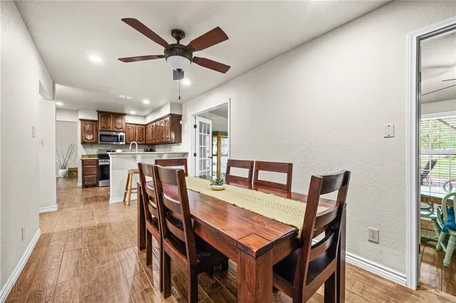 a dining room with furniture and window
