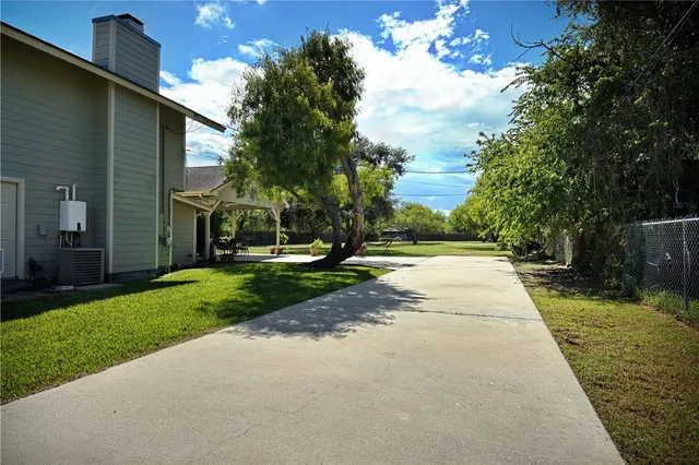 a view of a backyard with green space