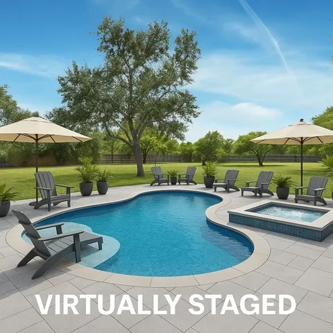 a view of a chairs and table under an umbrella