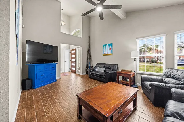 a living room with furniture and a flat screen tv