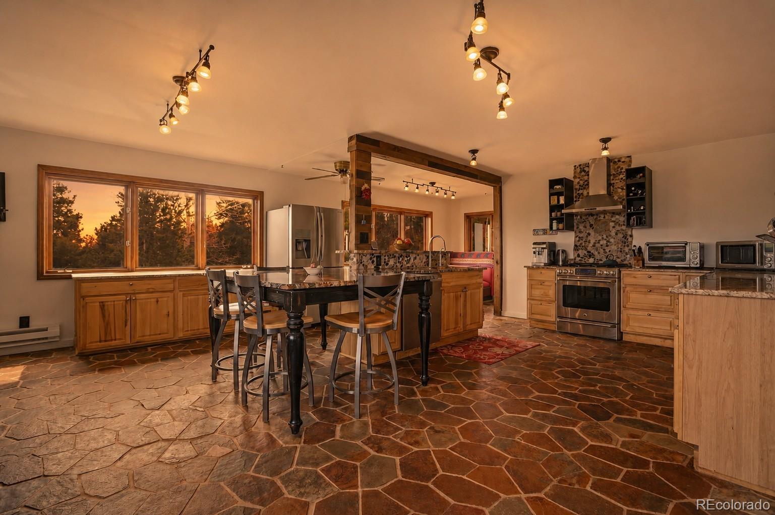 9225 Sandy Lane Conifer, CO 80433 - Photo 3 of 45 a view of a dining area with furniture