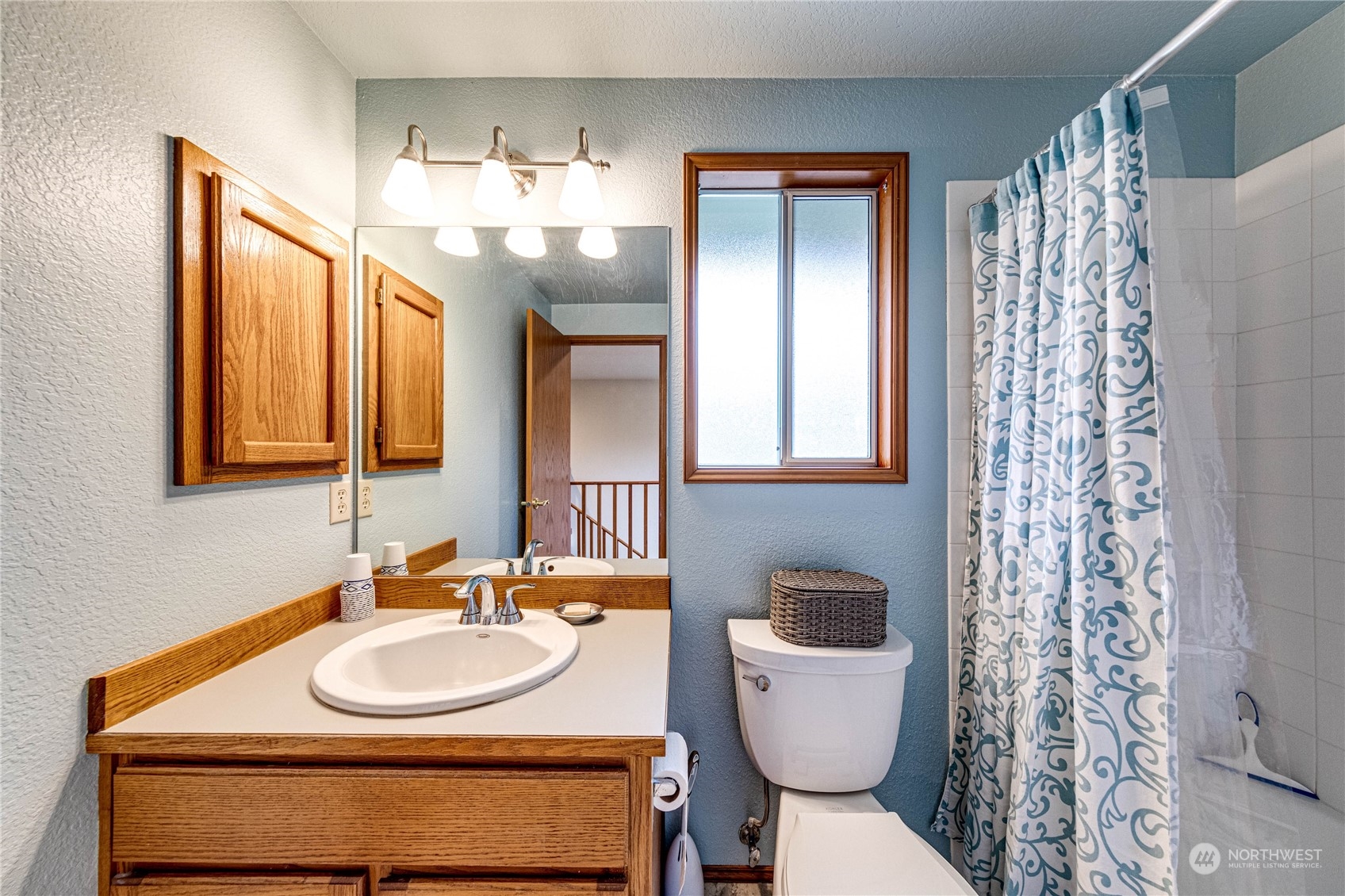 3213 211th Street Southeast Bothell, WA 98021 - Photo 22 of 33 a bathroom with a sink and a mirror
