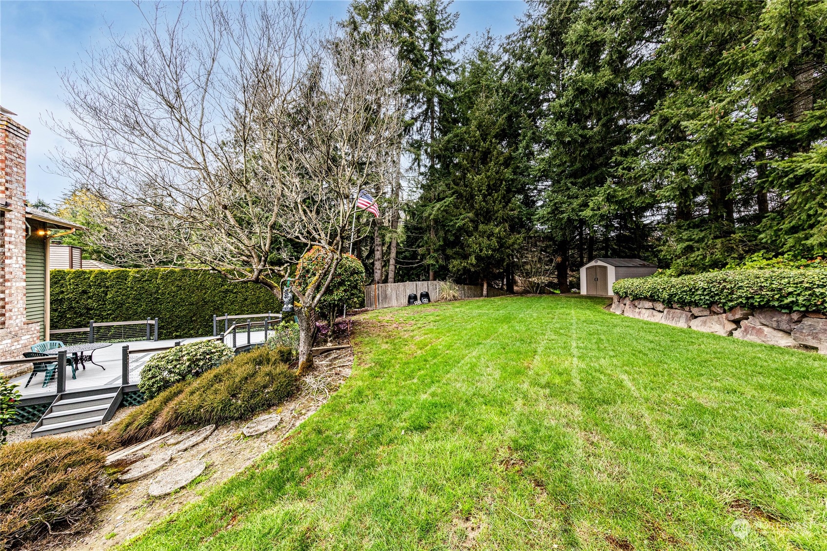 3213 211th Street Southeast Bothell, WA 98021 - Photo 30 of 33 a view of a backyard with sitting area