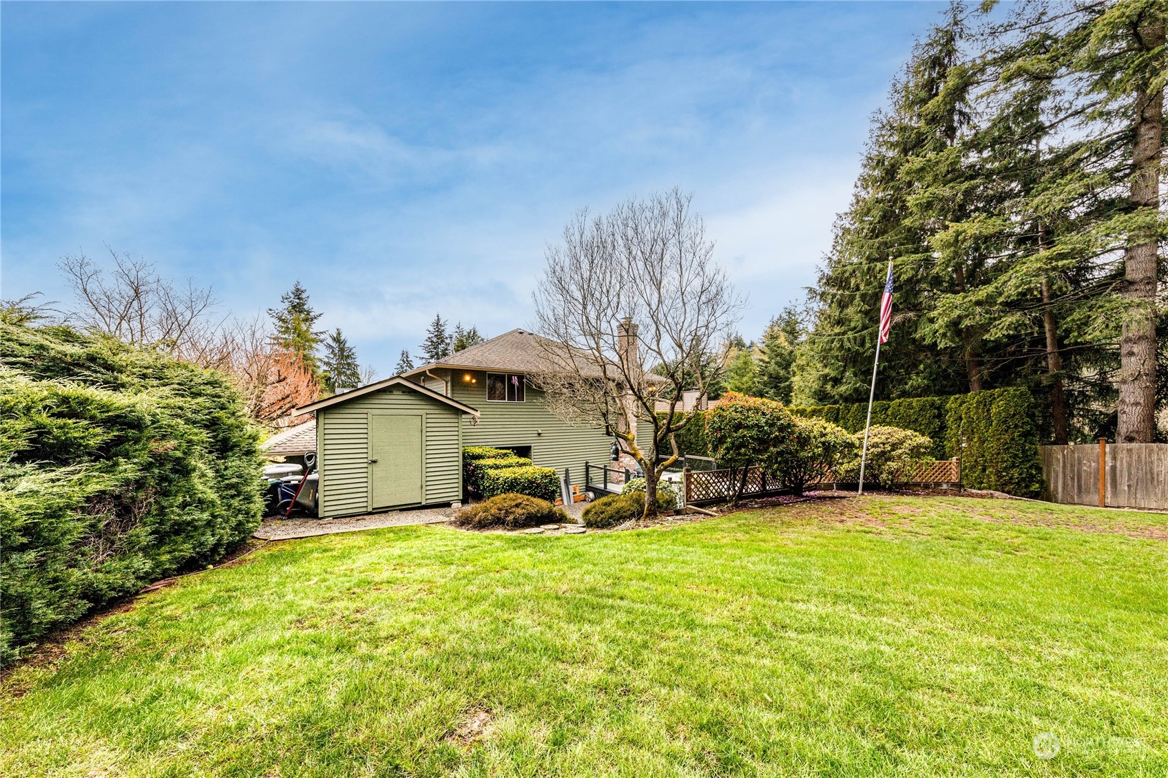 3213 211th Street Southeast Bothell, WA 98021 - Photo 31 of 33 a view of a house with a yard and sitting area
