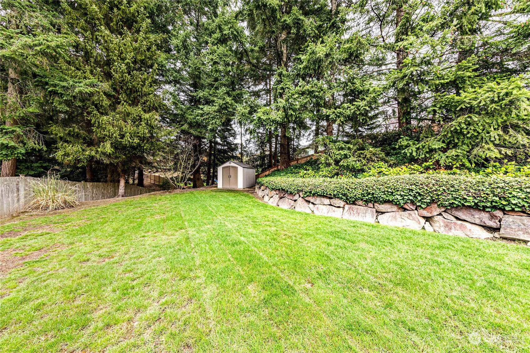 3213 211th Street Southeast Bothell, WA 98021 - Photo 32 of 33 a view of a backyard with a small cabin