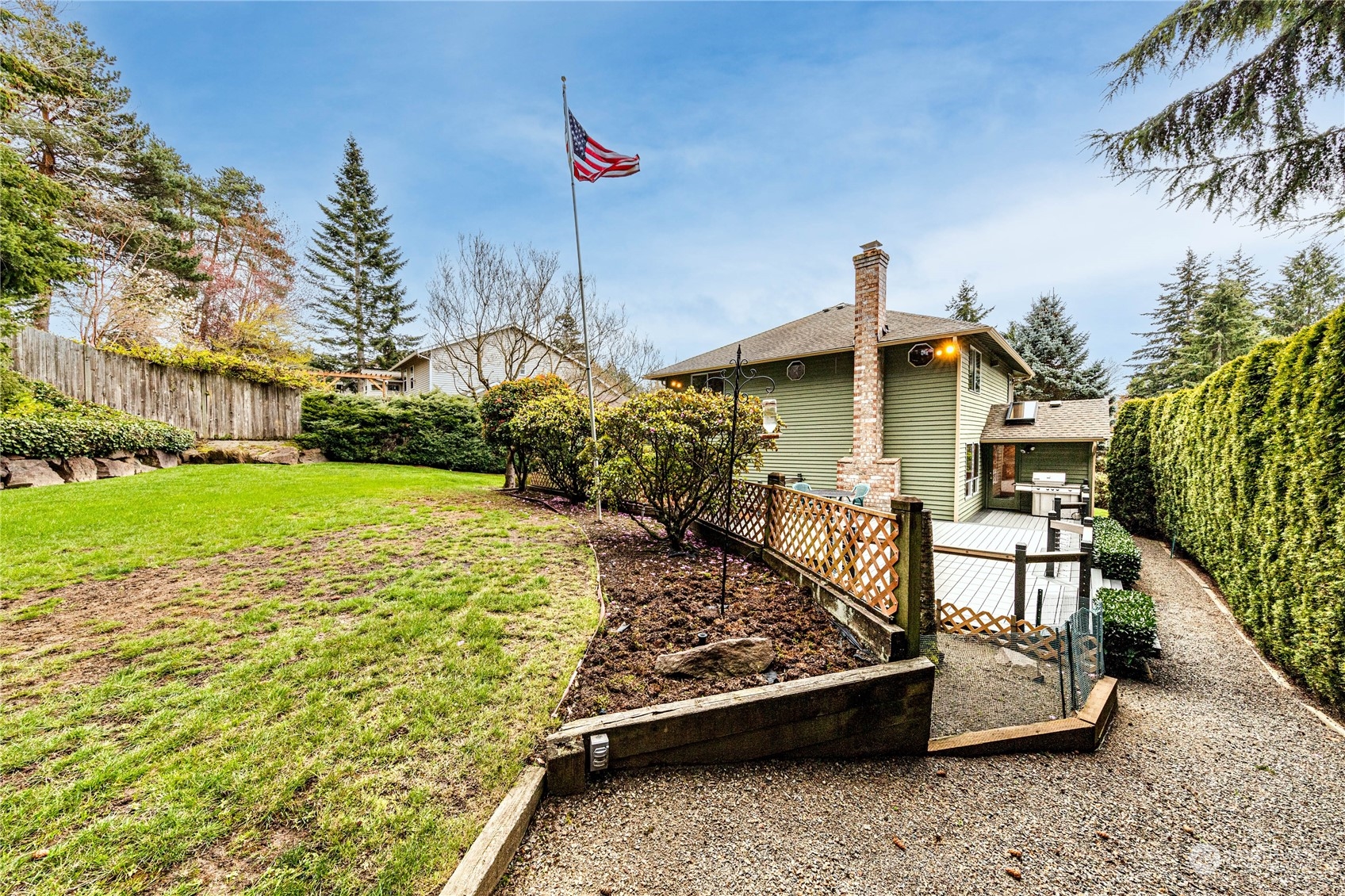 3213 211th Street Southeast Bothell, WA 98021 - Photo 33 of 33 a front view of a house with a yard