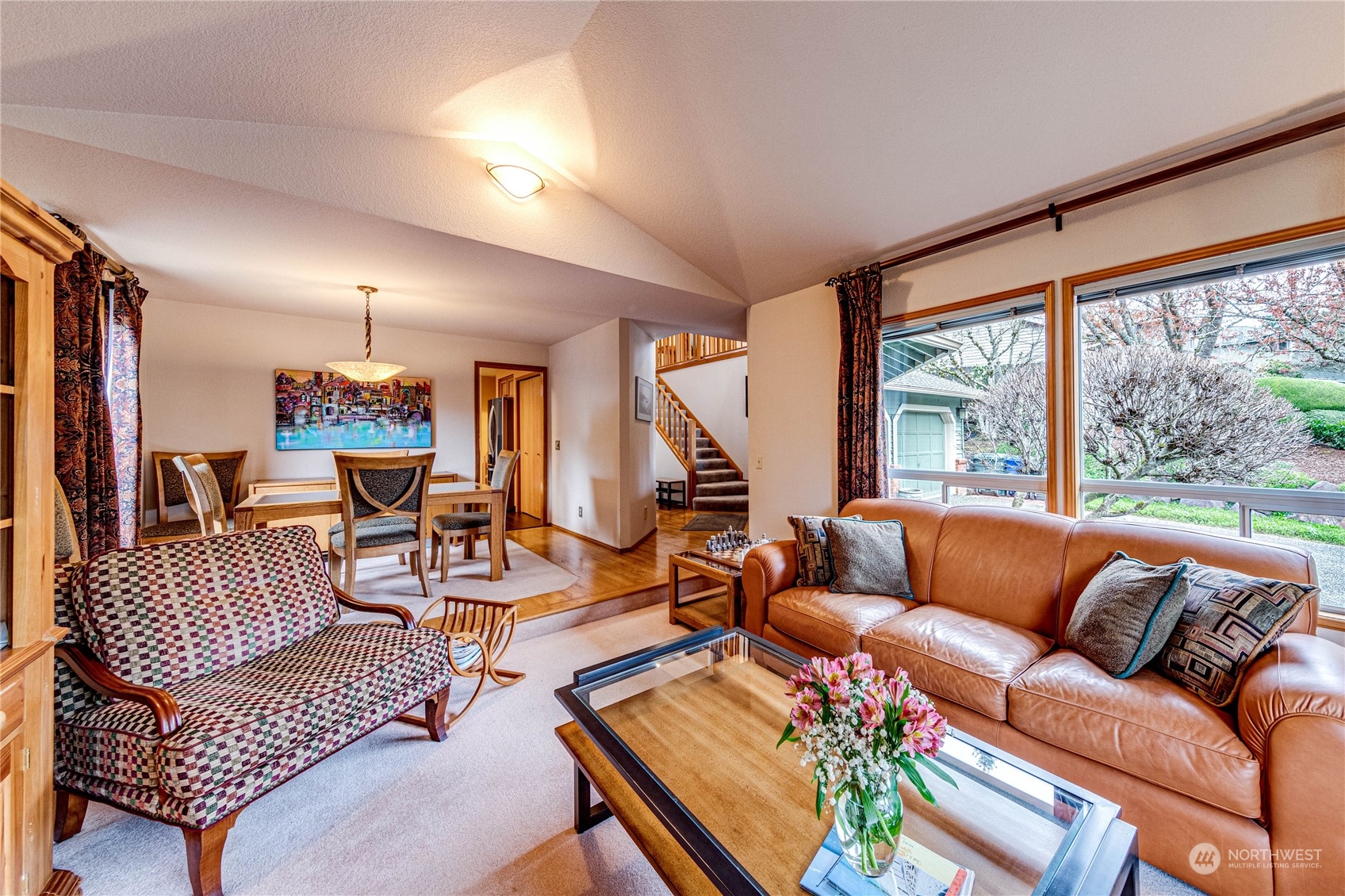 3213 211th Street Southeast Bothell, WA 98021 - Photo 8 of 33 a living room with furniture and a large window