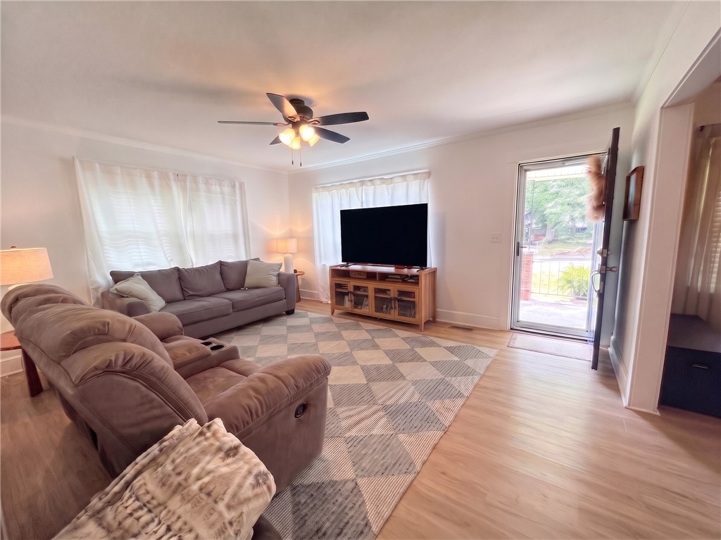 710 O Neal Street Belton, SC 29627 - Photo 5 of 18 A well-lit living area features easy-care flooring and an inviting entry.