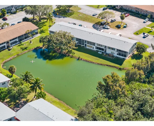 an aerial view of a house with a swimming pool