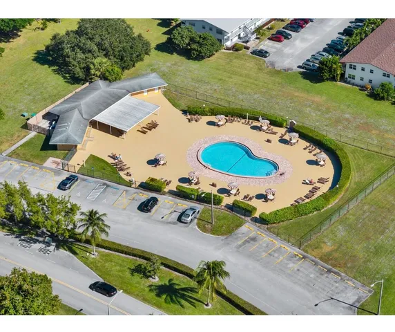 an aerial view of a house with outdoor space
