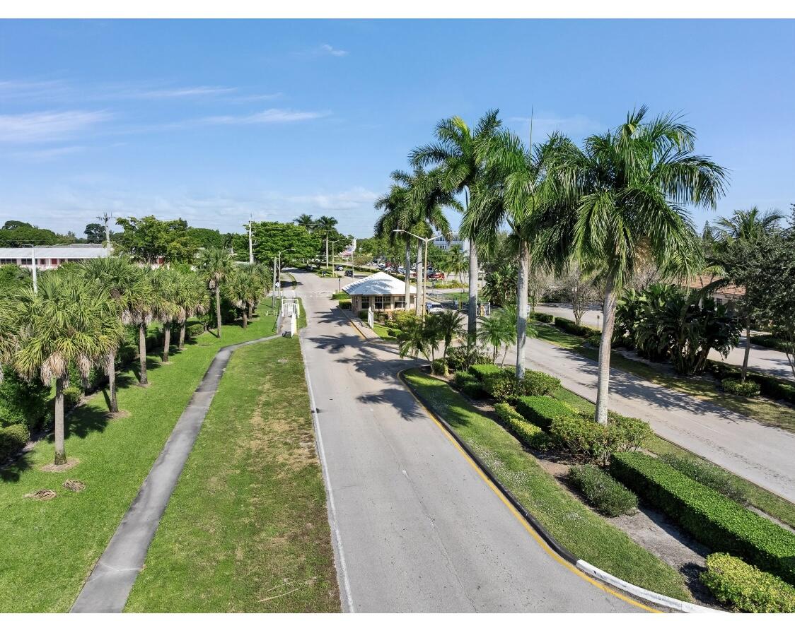 209 Northampton K, Unit K West Palm Beach, FL 33417 - Photo 23 of 24 a view of an outdoor space with a swimming pool