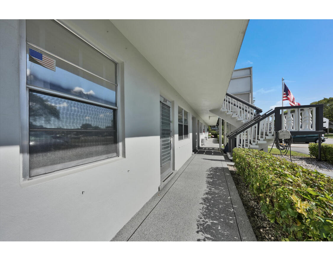 209 Northampton K, Unit K West Palm Beach, FL 33417 - Photo 8 of 24 a view of entryway with wooden floor