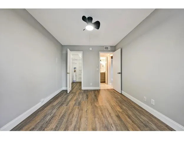 a view of an empty room with glass door