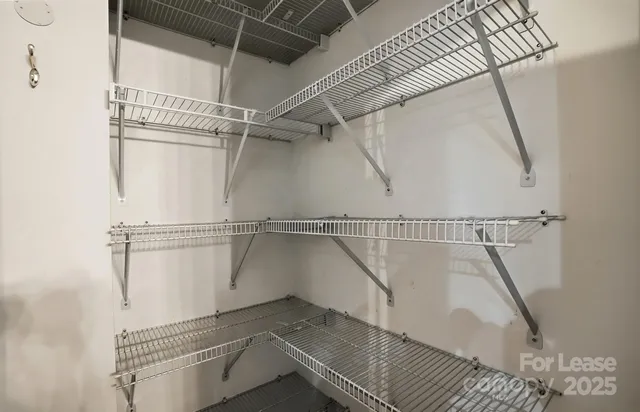 a view of a room with racks on the wall