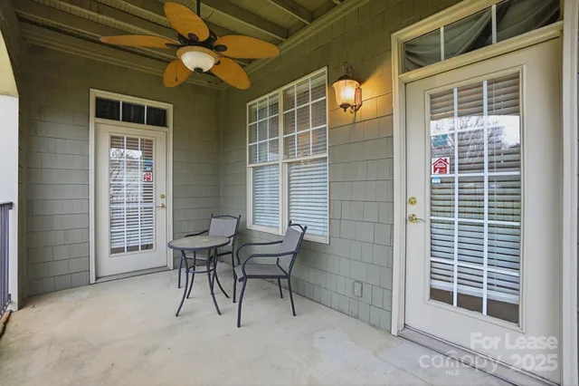 a view of a door and a chair and a window