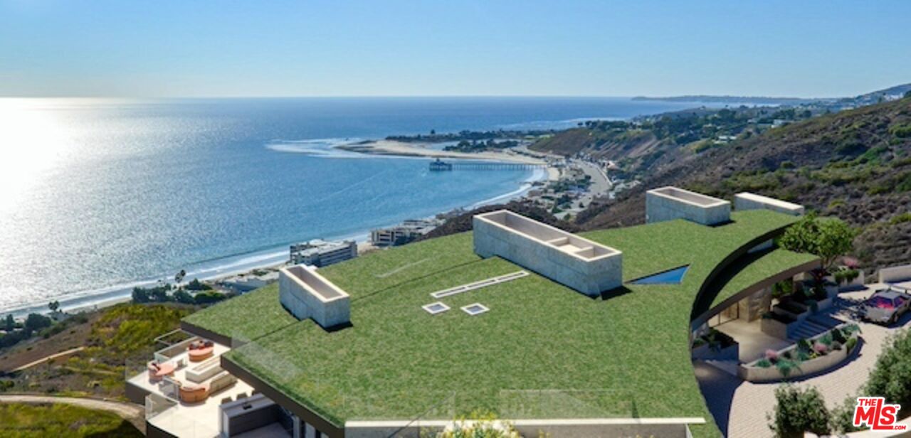 5024 Carbon Beach Terrace Malibu, CA 90265 - Photo 3 of 35 an aerial view of a house with a garden and mountain view in back