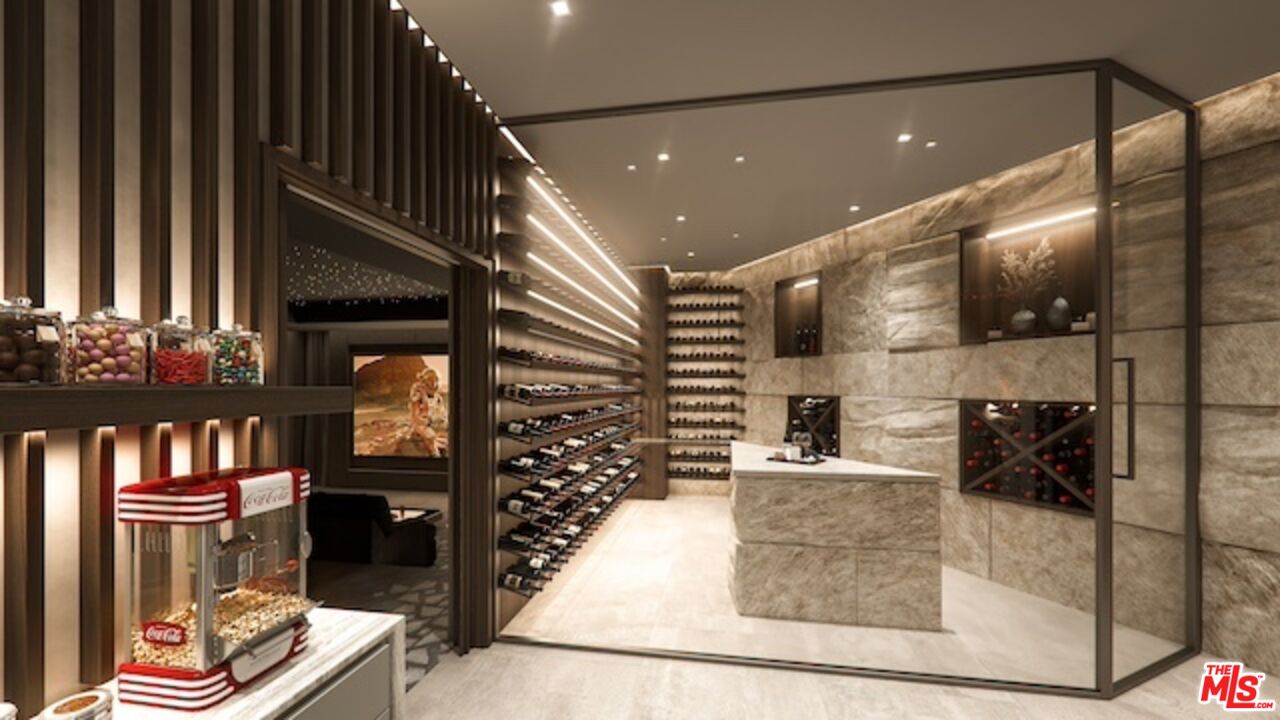 5024 Carbon Beach Terrace Malibu, CA 90265 - Photo 33 of 35 a kitchen with stainless steel appliances kitchen island granite countertop a refrigerator and a stove