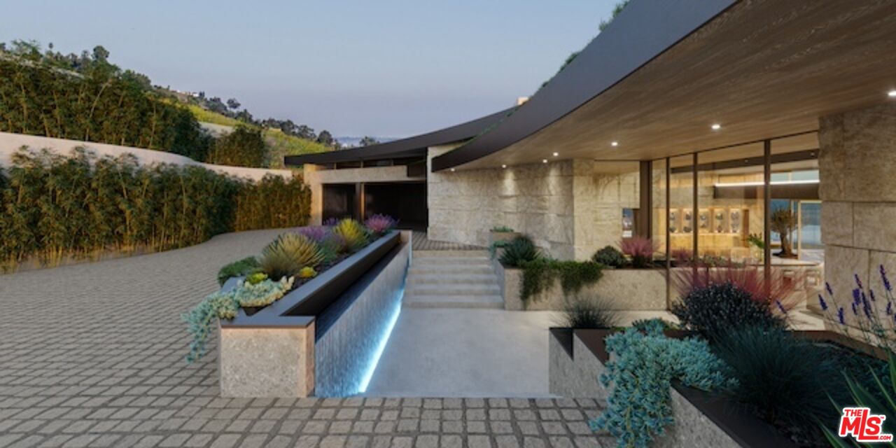 5024 Carbon Beach Terrace Malibu, CA 90265 - Photo 9 of 35 a front view of a house with a yard