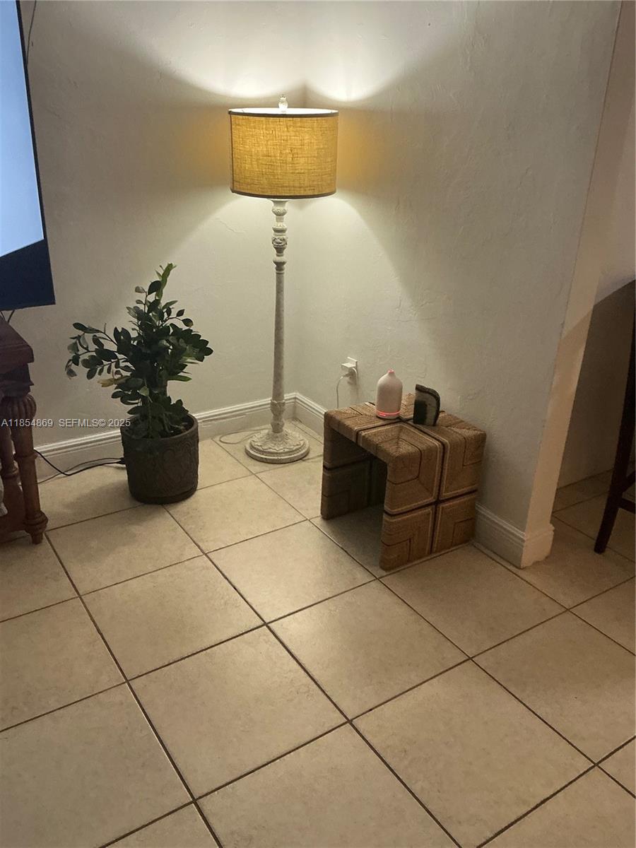 1855 Northwest 32nd Street Miami, FL 33142 - Photo 14 of 23 a room with furniture and a potted plant