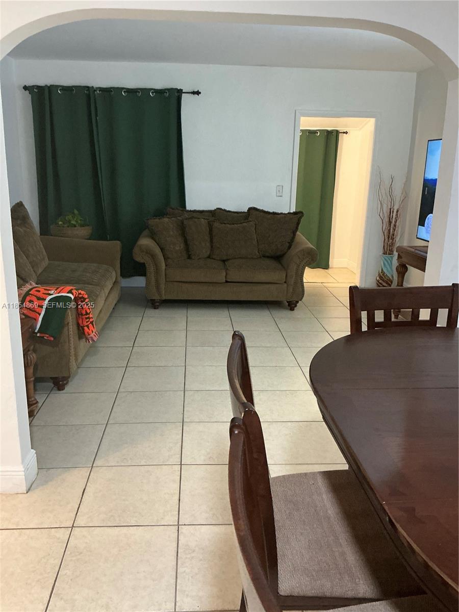 1855 Northwest 32nd Street Miami, FL 33142 - Photo 17 of 23 a living room with furniture