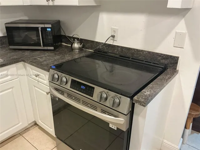 a close view of a stove top oven sitting inside of a kitchen