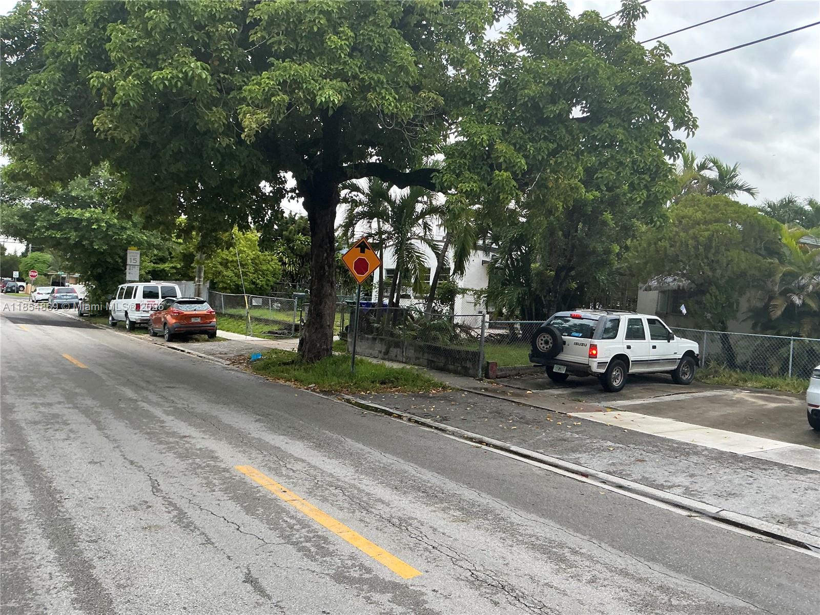 1855 Northwest 32nd Street Miami, FL 33142 - Photo 2 of 23 a car parked on the side of the road