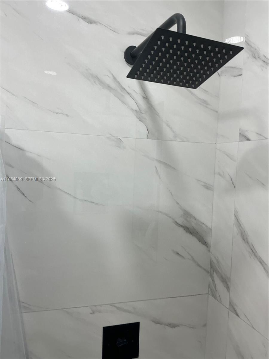 1855 Northwest 32nd Street Miami, FL 33142 - Photo 23 of 23 a bathroom with a shower