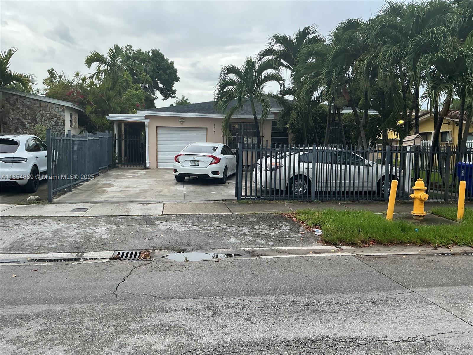 1855 Northwest 32nd Street Miami, FL 33142 - Photo 4 of 23 a view of backyard and a garden