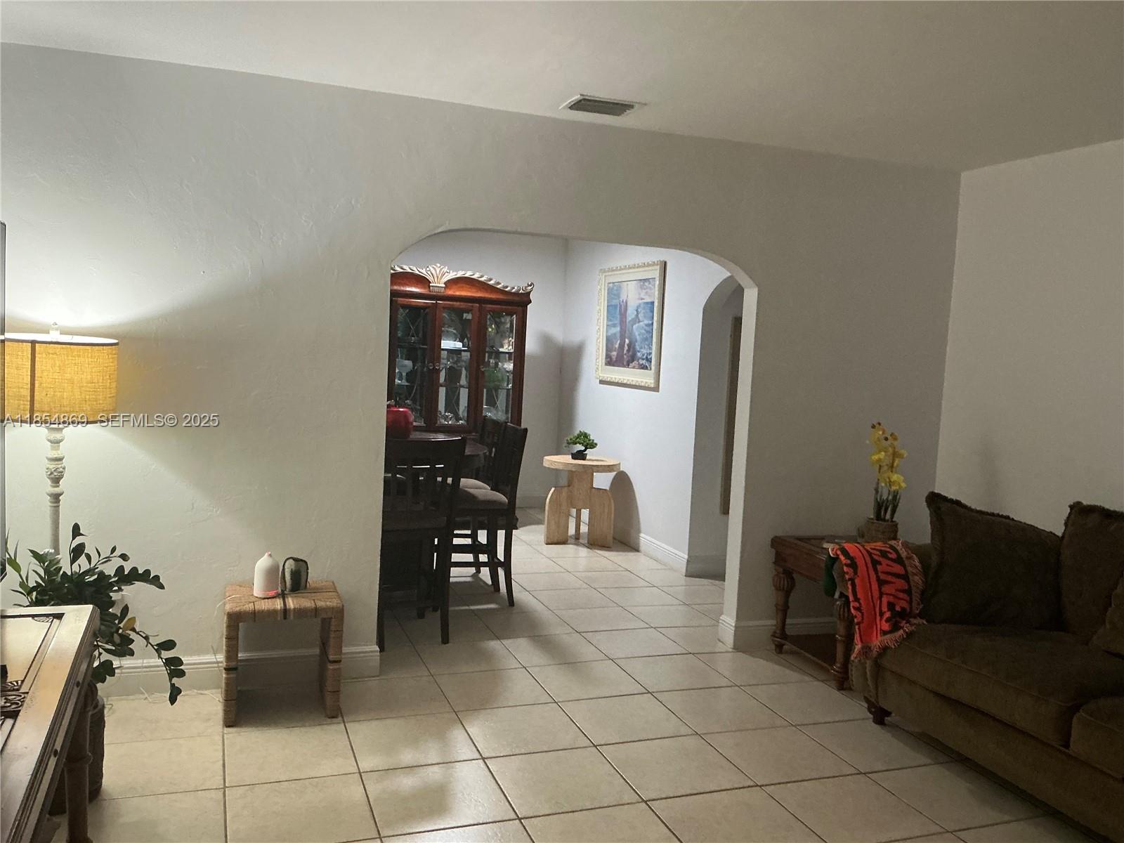 1855 Northwest 32nd Street Miami, FL 33142 - Photo 7 of 23 a living room with furniture