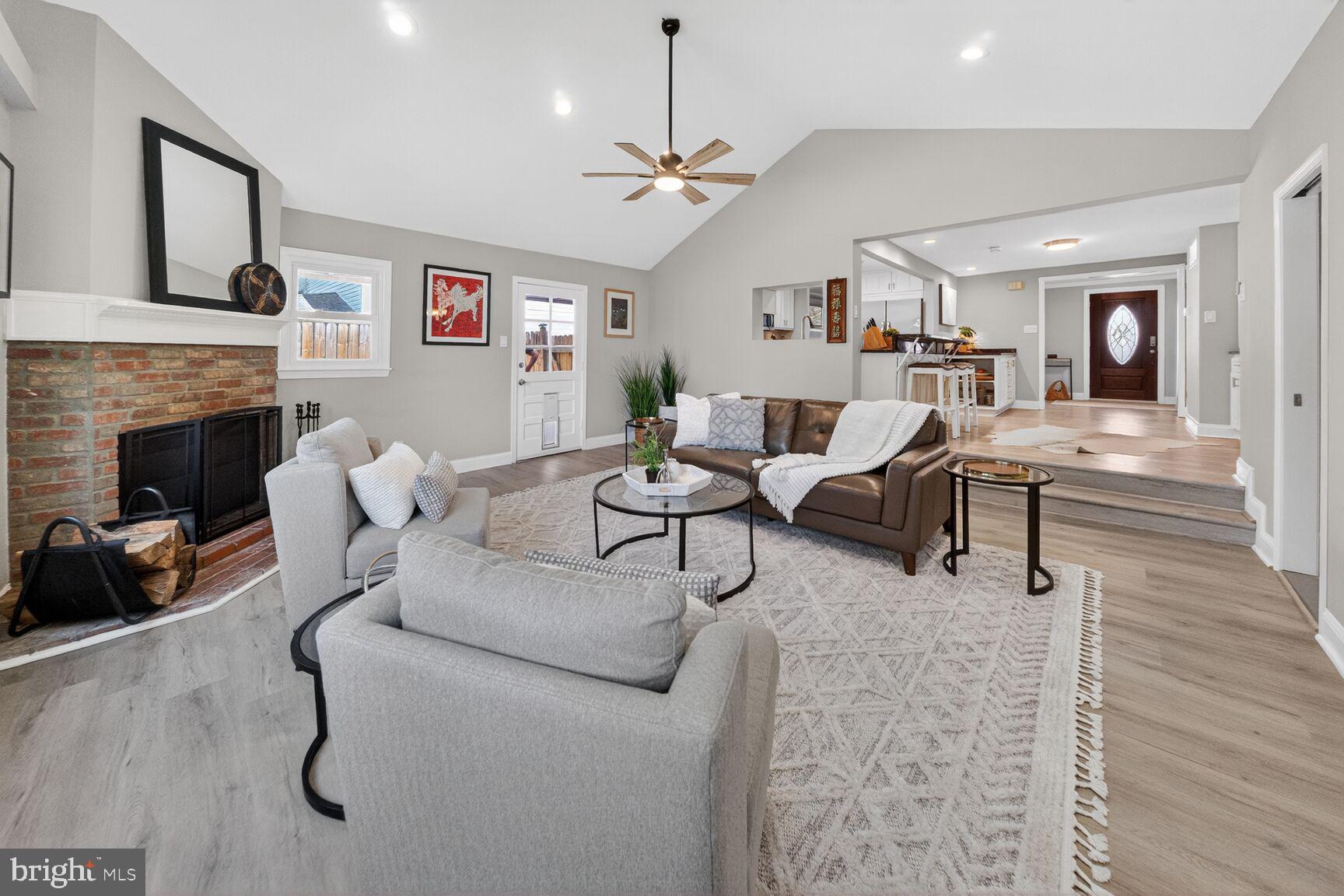 7007 Lemay Road Rockville, MD 20851 - Photo 11 of 37 a living room with furniture and a fireplace